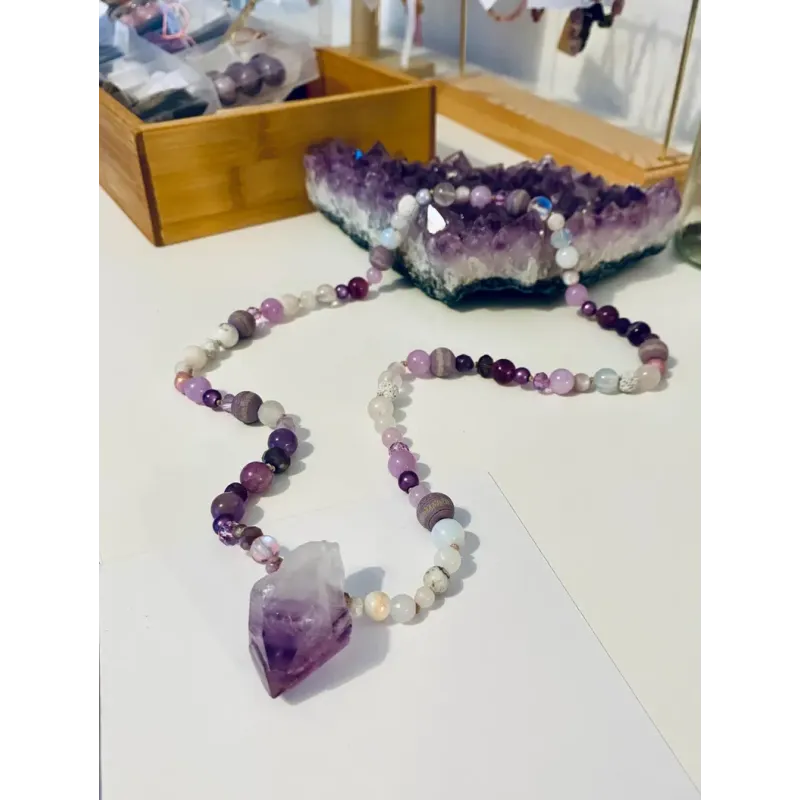 Gemstone necklace with an amethyst pendant in the mala style
