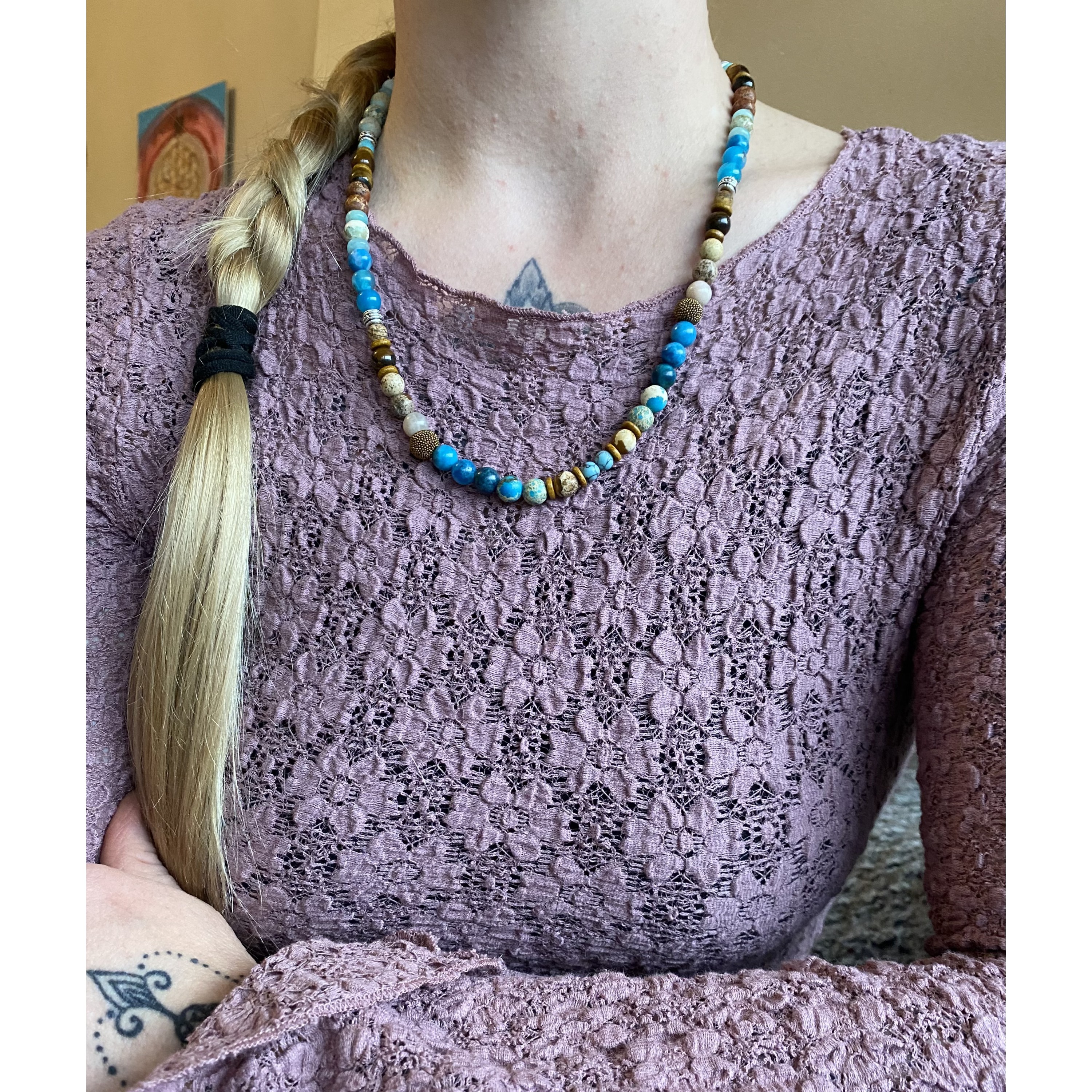 A beautiful gemstone necklace in shades of blue and brown